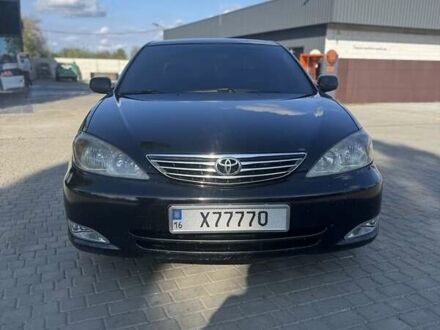 Черный Тойота Камри, объемом двигателя 2.4 л и пробегом 350 тыс. км за 6800 $, фото 1 на Automoto.ua