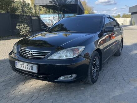 Черный Тойота Камри, объемом двигателя 2.4 л и пробегом 350 тыс. км за 6800 $, фото 1 на Automoto.ua