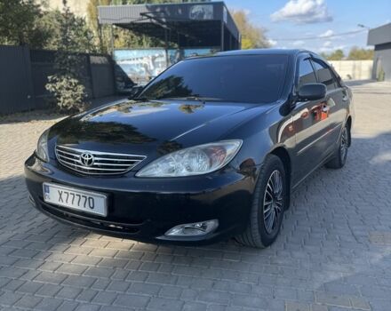 Черный Тойота Камри, объемом двигателя 2.4 л и пробегом 350 тыс. км за 6800 $, фото 1 на Automoto.ua