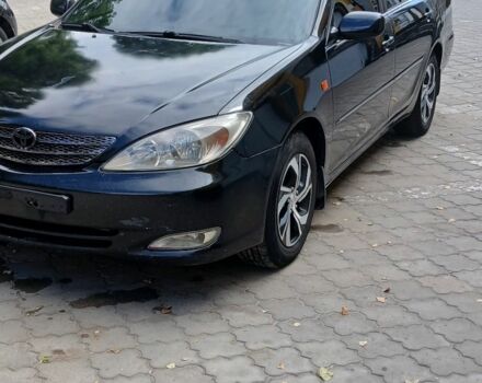 Черный Тойота Камри, объемом двигателя 2.4 л и пробегом 307 тыс. км за 4500 $, фото 1 на Automoto.ua