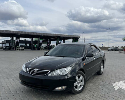 Черный Тойота Камри, объемом двигателя 2.4 л и пробегом 225 тыс. км за 7500 $, фото 1 на Automoto.ua