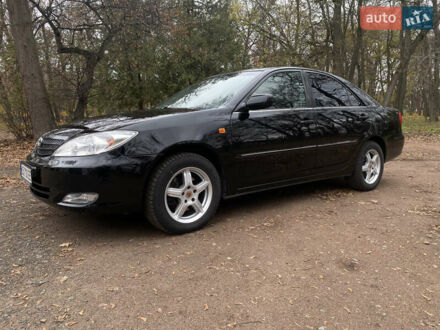 Чорний Тойота Камрі, об'ємом двигуна 2.4 л та пробігом 201 тис. км за 6999 $, фото 1 на Automoto.ua