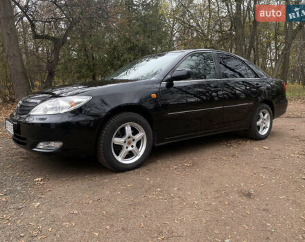 Чорний Тойота Камрі, об'ємом двигуна 2.4 л та пробігом 201 тис. км за 6999 $, фото 1 на Automoto.ua