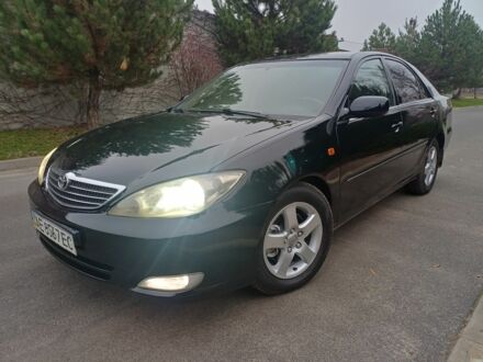 Черный Тойота Камри, объемом двигателя 2.4 л и пробегом 250 тыс. км за 5500 $, фото 1 на Automoto.ua