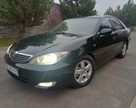 Черный Тойота Камри, объемом двигателя 2.4 л и пробегом 250 тыс. км за 5500 $, фото 1 на Automoto.ua