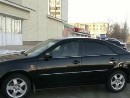 Черный Тойота Камри, объемом двигателя 2.4 л и пробегом 294 тыс. км за 7000 $, фото 1 на Automoto.ua