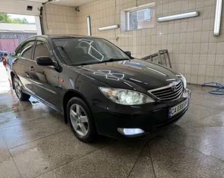 Черный Тойота Камри, объемом двигателя 2.4 л и пробегом 400 тыс. км за 2900 $, фото 1 на Automoto.ua