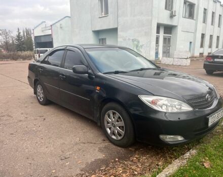 Черный Тойота Камри, объемом двигателя 2.4 л и пробегом 540 тыс. км за 3199 $, фото 1 на Automoto.ua