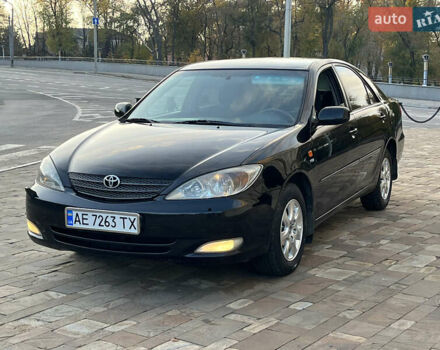 Черный Тойота Камри, объемом двигателя 2.4 л и пробегом 325 тыс. км за 4500 $, фото 1 на Automoto.ua