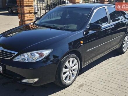Черный Тойота Камри, объемом двигателя 2.36 л и пробегом 375 тыс. км за 7600 $, фото 1 на Automoto.ua