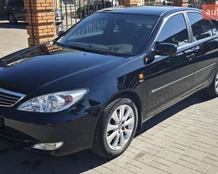 Черный Тойота Камри, объемом двигателя 2.36 л и пробегом 375 тыс. км за 7600 $, фото 1 на Automoto.ua