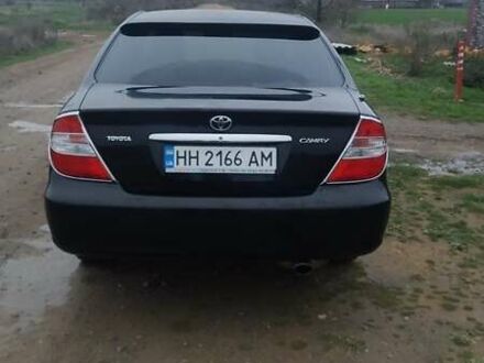 Черный Тойота Камри, объемом двигателя 2.4 л и пробегом 290 тыс. км за 7000 $, фото 1 на Automoto.ua