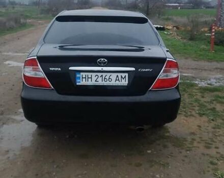 Черный Тойота Камри, объемом двигателя 2.4 л и пробегом 290 тыс. км за 7000 $, фото 1 на Automoto.ua
