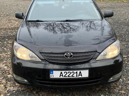 Чорний Тойота Камрі, об'ємом двигуна 2.4 л та пробігом 310 тис. км за 5600 $, фото 1 на Automoto.ua