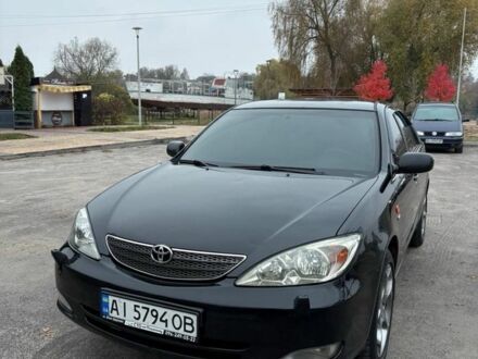 Черный Тойота Камри, объемом двигателя 2.4 л и пробегом 570 тыс. км за 6199 $, фото 1 на Automoto.ua