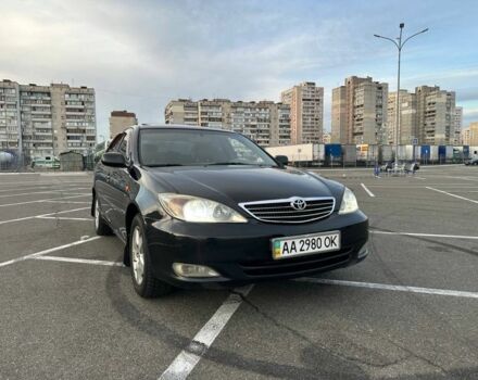 Черный Тойота Камри, объемом двигателя 2.4 л и пробегом 313 тыс. км за 5800 $, фото 1 на Automoto.ua