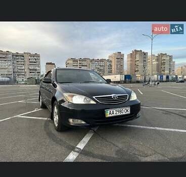 Черный Тойота Камри, объемом двигателя 2.4 л и пробегом 315 тыс. км за 5800 $, фото 1 на Automoto.ua