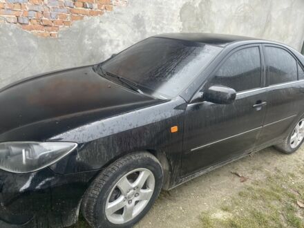 Черный Тойота Камри, объемом двигателя 3 л и пробегом 200 тыс. км за 6000 $, фото 1 на Automoto.ua