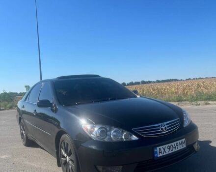 Чорний Тойота Камрі, об'ємом двигуна 2.4 л та пробігом 240 тис. км за 6200 $, фото 1 на Automoto.ua