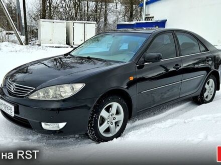 Черный Тойота Камри, объемом двигателя 2.4 л и пробегом 173 тыс. км за 5800 $, фото 1 на Automoto.ua