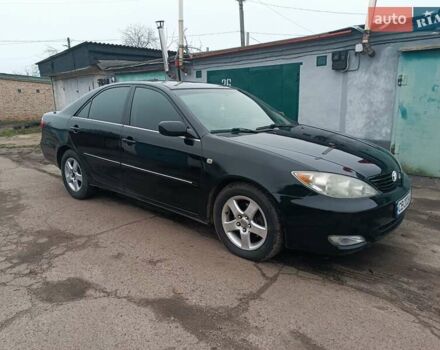 Черный Тойота Камри, объемом двигателя 3 л и пробегом 370 тыс. км за 4500 $, фото 1 на Automoto.ua