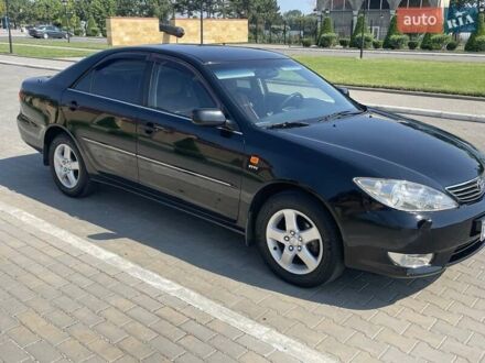 Чорний Тойота Камрі, об'ємом двигуна 2.4 л та пробігом 220 тис. км за 7300 $, фото 1 на Automoto.ua