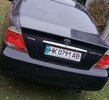 Чорний Тойота Камрі, об'ємом двигуна 2.4 л та пробігом 300 тис. км за 5500 $, фото 1 на Automoto.ua