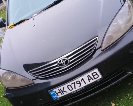 Черный Тойота Камри, объемом двигателя 2.4 л и пробегом 300 тыс. км за 5100 $, фото 1 на Automoto.ua