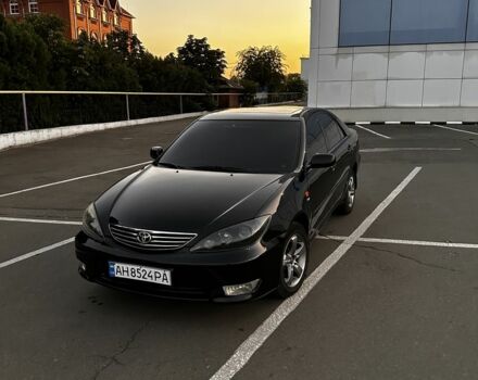 Черный Тойота Камри, объемом двигателя 2.4 л и пробегом 240 тыс. км за 5500 $, фото 1 на Automoto.ua