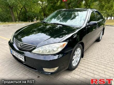 Черный Тойота Камри, объемом двигателя 3 л и пробегом 300 тыс. км за 6200 $, фото 1 на Automoto.ua