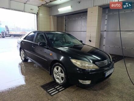 Черный Тойота Камри, объемом двигателя 3 л и пробегом 210 тыс. км за 7200 $, фото 1 на Automoto.ua