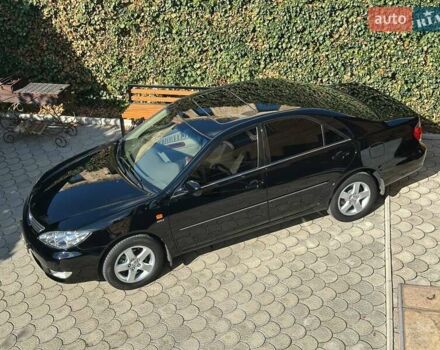 Черный Тойота Камри, объемом двигателя 2.36 л и пробегом 253 тыс. км за 6900 $, фото 1 на Automoto.ua