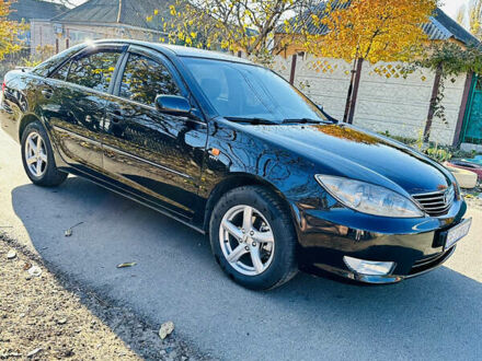 Чорний Тойота Камрі, об'ємом двигуна 2.4 л та пробігом 253 тис. км за 6100 $, фото 1 на Automoto.ua