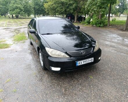 Черный Тойота Камри, объемом двигателя 2.4 л и пробегом 345 тыс. км за 5300 $, фото 1 на Automoto.ua