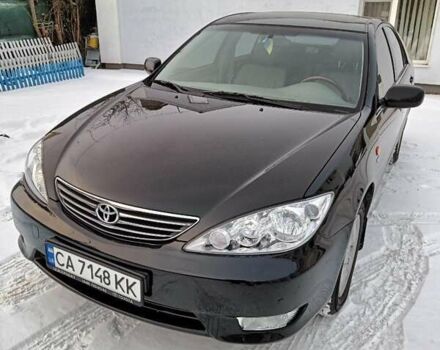 Черный Тойота Камри, объемом двигателя 2.4 л и пробегом 85 тыс. км за 10800 $, фото 1 на Automoto.ua