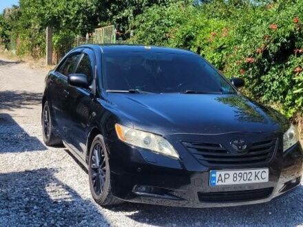 Черный Тойота Камри, объемом двигателя 3.5 л и пробегом 300 тыс. км за 7500 $, фото 1 на Automoto.ua