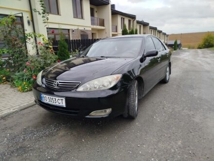 Черный Тойота Камри, объемом двигателя 2.4 л и пробегом 220 тыс. км за 5800 $, фото 1 на Automoto.ua