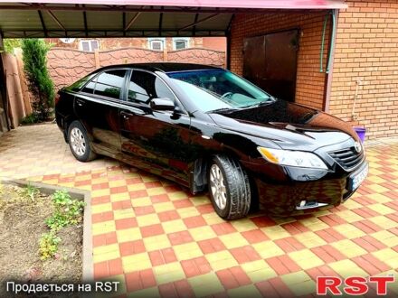 Черный Тойота Камри, объемом двигателя 2.4 л и пробегом 250 тыс. км за 8200 $, фото 1 на Automoto.ua