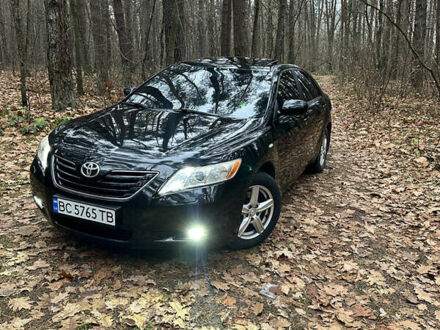 Черный Тойота Камри, объемом двигателя 2.36 л и пробегом 300 тыс. км за 7200 $, фото 1 на Automoto.ua