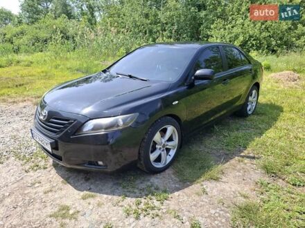 Черный Тойота Камри, объемом двигателя 2.36 л и пробегом 235 тыс. км за 9299 $, фото 1 на Automoto.ua