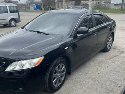Черный Тойота Камри, объемом двигателя 2.4 л и пробегом 250 тыс. км за 8500 $, фото 1 на Automoto.ua