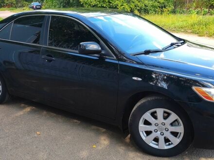 Черный Тойота Камри, объемом двигателя 2.4 л и пробегом 129 тыс. км за 10300 $, фото 1 на Automoto.ua