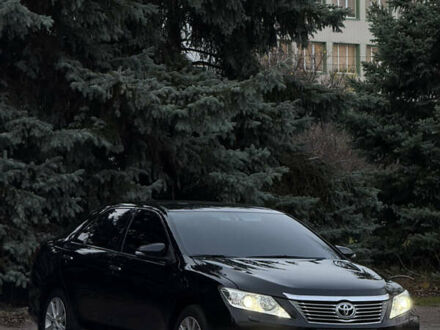 Чорний Тойота Камрі, об'ємом двигуна 2.49 л та пробігом 215 тис. км за 14500 $, фото 1 на Automoto.ua
