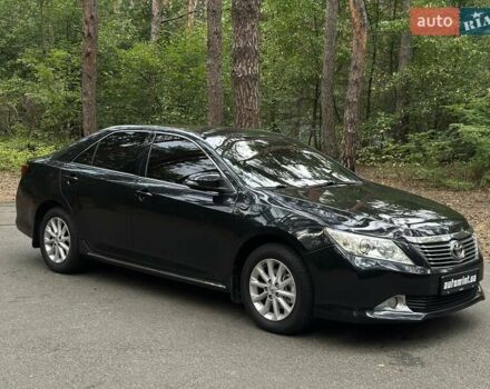Черный Тойота Камри, объемом двигателя 2.4 л и пробегом 200 тыс. км за 12900 $, фото 1 на Automoto.ua