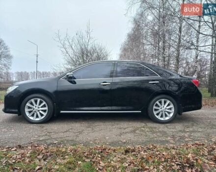 Чорний Тойота Камрі, об'ємом двигуна 2.5 л та пробігом 130 тис. км за 15900 $, фото 1 на Automoto.ua