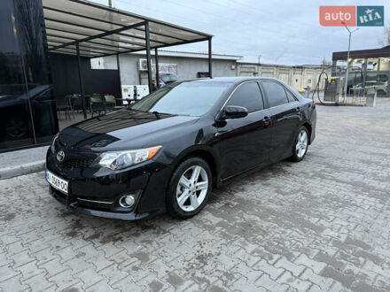 Черный Тойота Камри, объемом двигателя 2.49 л и пробегом 230 тыс. км за 13200 $, фото 1 на Automoto.ua