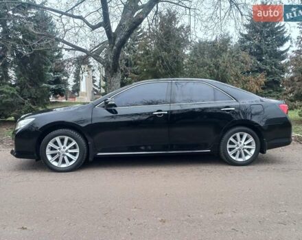 Черный Тойота Камри, объемом двигателя 2.5 л и пробегом 127 тыс. км за 15700 $, фото 1 на Automoto.ua