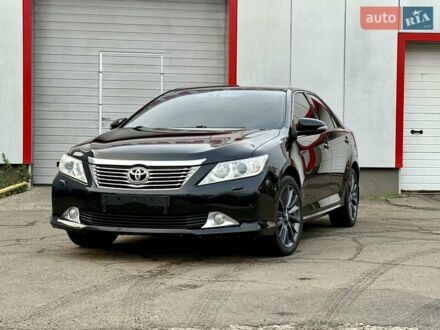 Черный Тойота Камри, объемом двигателя 2.5 л и пробегом 170 тыс. км за 13900 $, фото 1 на Automoto.ua
