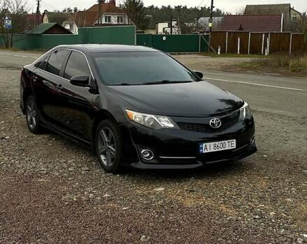 Черный Тойота Камри, объемом двигателя 2.5 л и пробегом 252 тыс. км за 10500 $, фото 1 на Automoto.ua