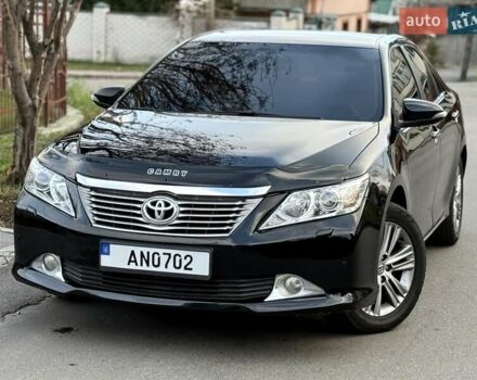 Черный Тойота Камри, объемом двигателя 2.49 л и пробегом 185 тыс. км за 12000 $, фото 1 на Automoto.ua